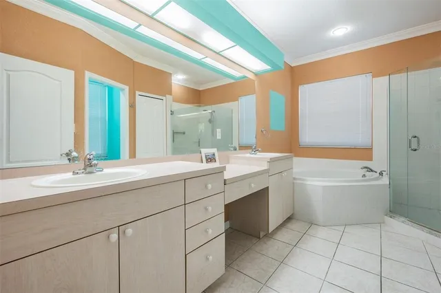 a view of an empty room with chandelier fan and a window