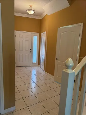 a bathroom with a sink and mirror with window