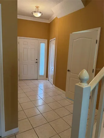 a bathroom with a sink and mirror with window