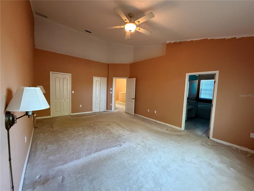 3494 Primrose Way Palm Harbor, FL 34683 - Photo 65 of 68 a view of an empty room with chandelier fan and a window
