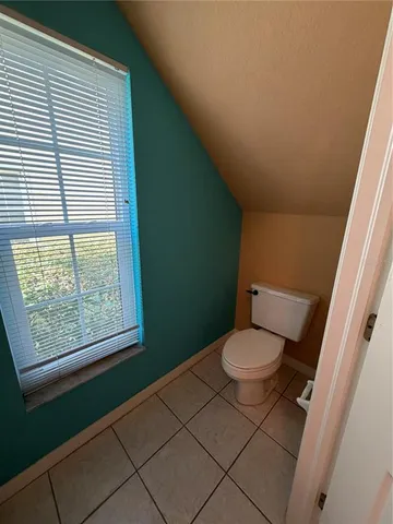 a kitchen with white cabinets appliances and a sink