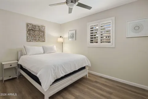 a bedroom with a large bed and a window