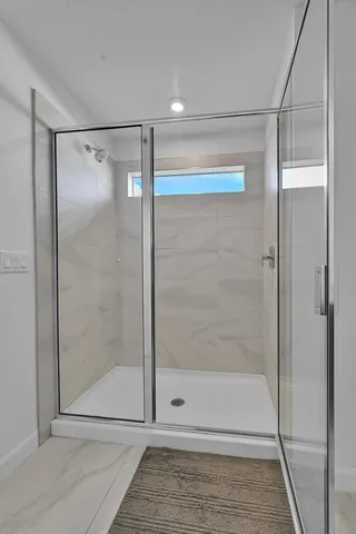 a view of a livingroom with furniture and window