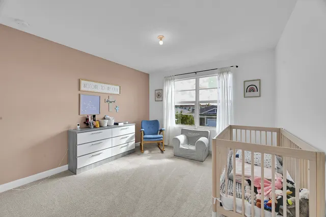a view of bedroom with furniture and wooden floor