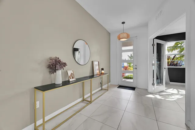 a view of a kitchen with a sink and cabinets
