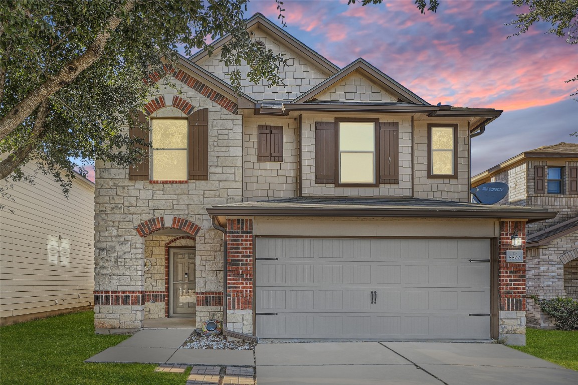 8800 Wiley Way Austin, TX 78747 - Photo 1 of 1 a front view of a house with garden
