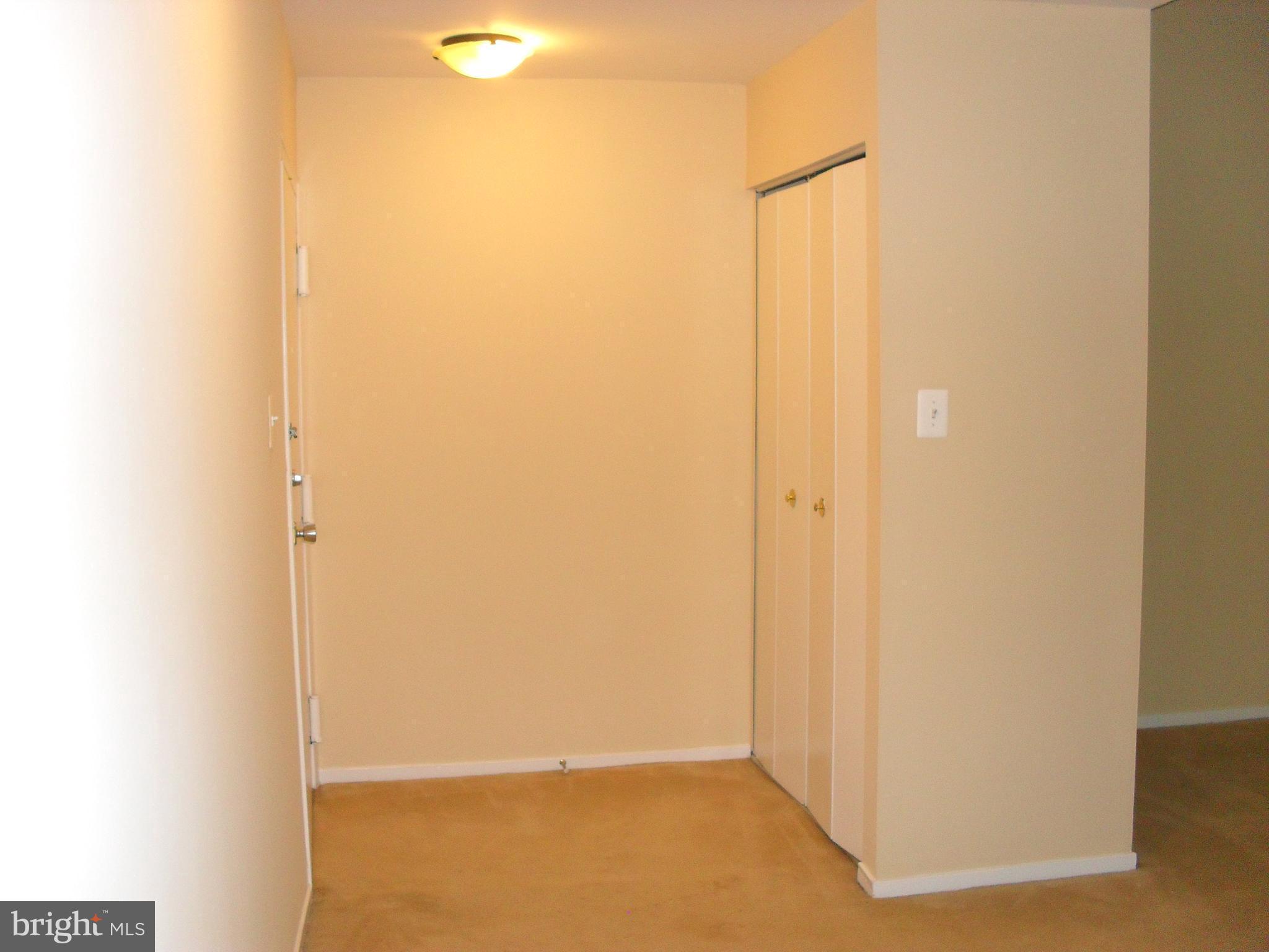 1659 Parkcrest Circle, Unit C Reston, VA 20190 - Photo 2 of 17 Welcoming foyer with double door coat closet
