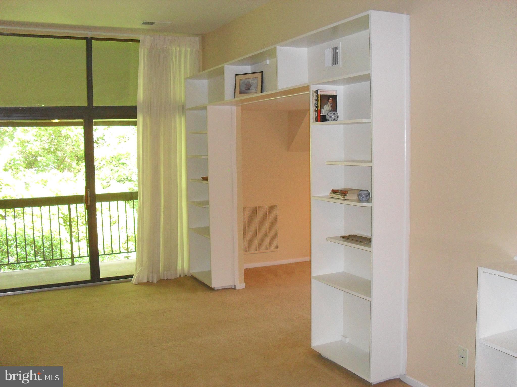 1659 Parkcrest Circle, Unit C Reston, VA 20190 - Photo 3 of 17 Built in bookcases flank entry to dining room