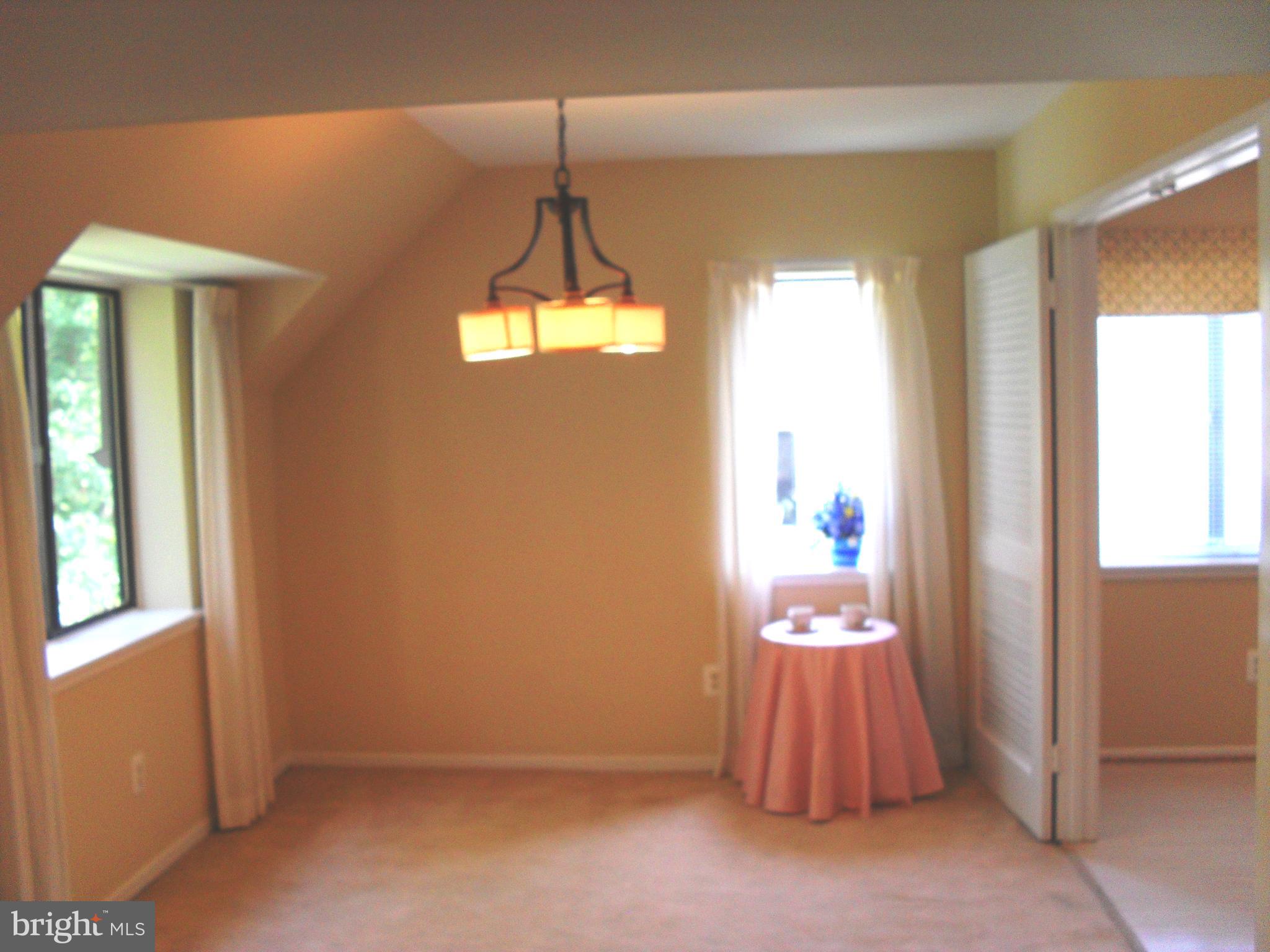 1659 Parkcrest Circle, Unit C Reston, VA 20190 - Photo 6 of 17 two windows in dining room open to kitchn