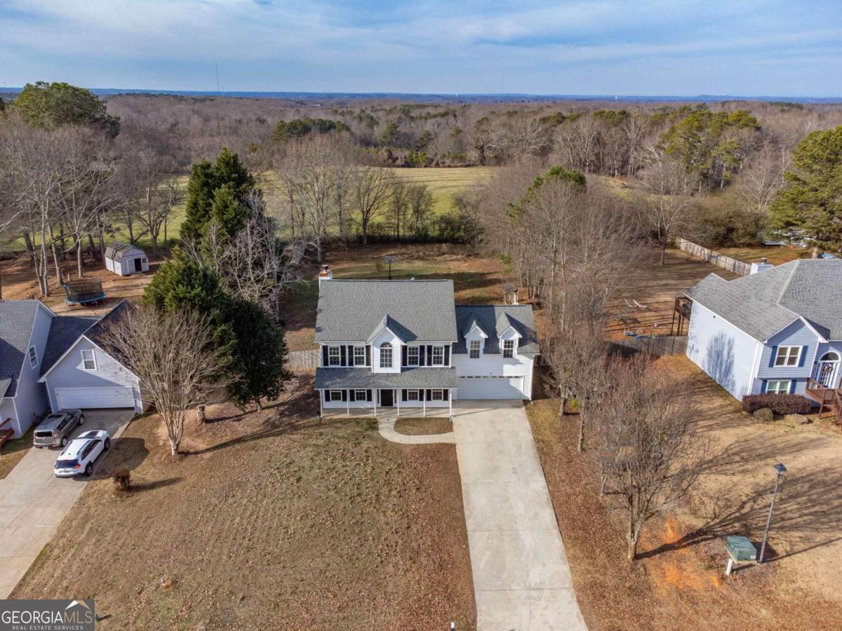 an aerial view of multiple house with outdoor space