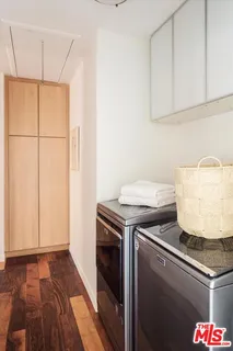 a kitchen with a stove and a shower