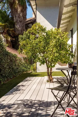 a bedroom with a bed and a mirror