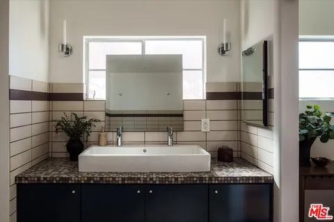 a bathroom with a bathtub and shower