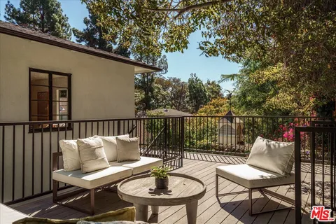 a view of a house with a snow in the yard