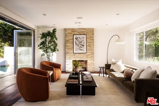 a living room with furniture or couch and a large window