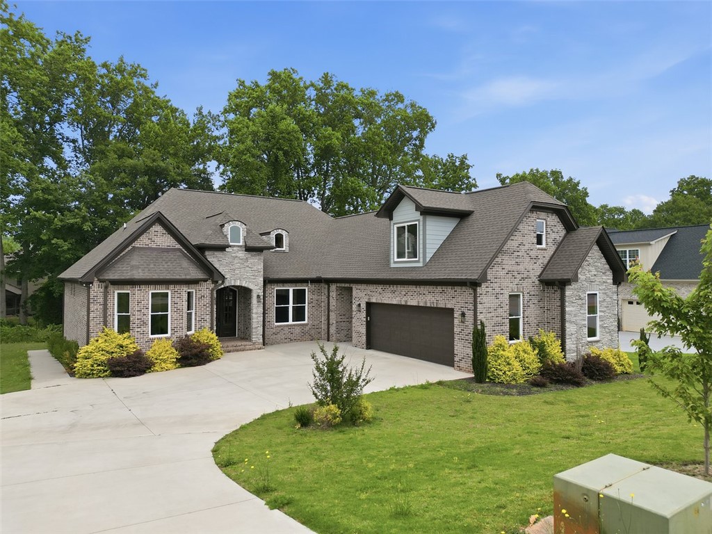 105 Bree Drive Anderson, SC 29621 - Photo 4 of 48 A graceful brick facade with stone accents and a wide driveway greets you home.