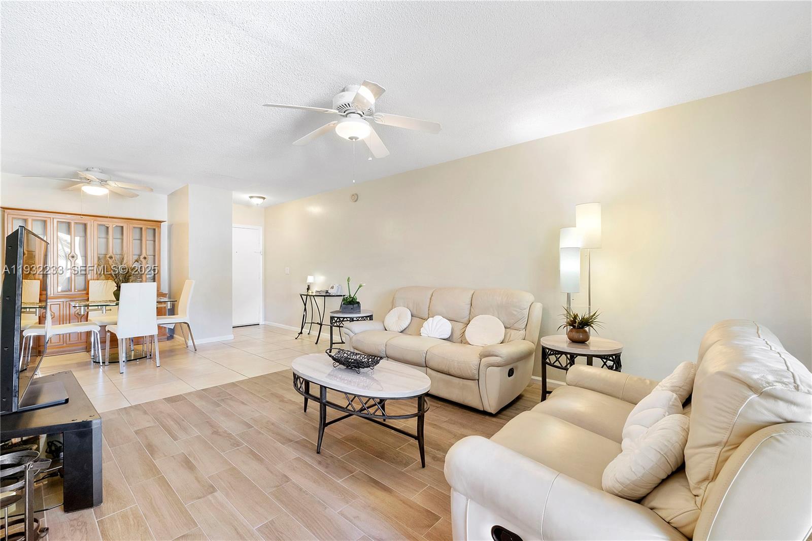 6750 Northeast 21st Road, Unit 124 Fort Lauderdale, FL 33308 - Photo 11 of 50 a living room with furniture and wooden floor