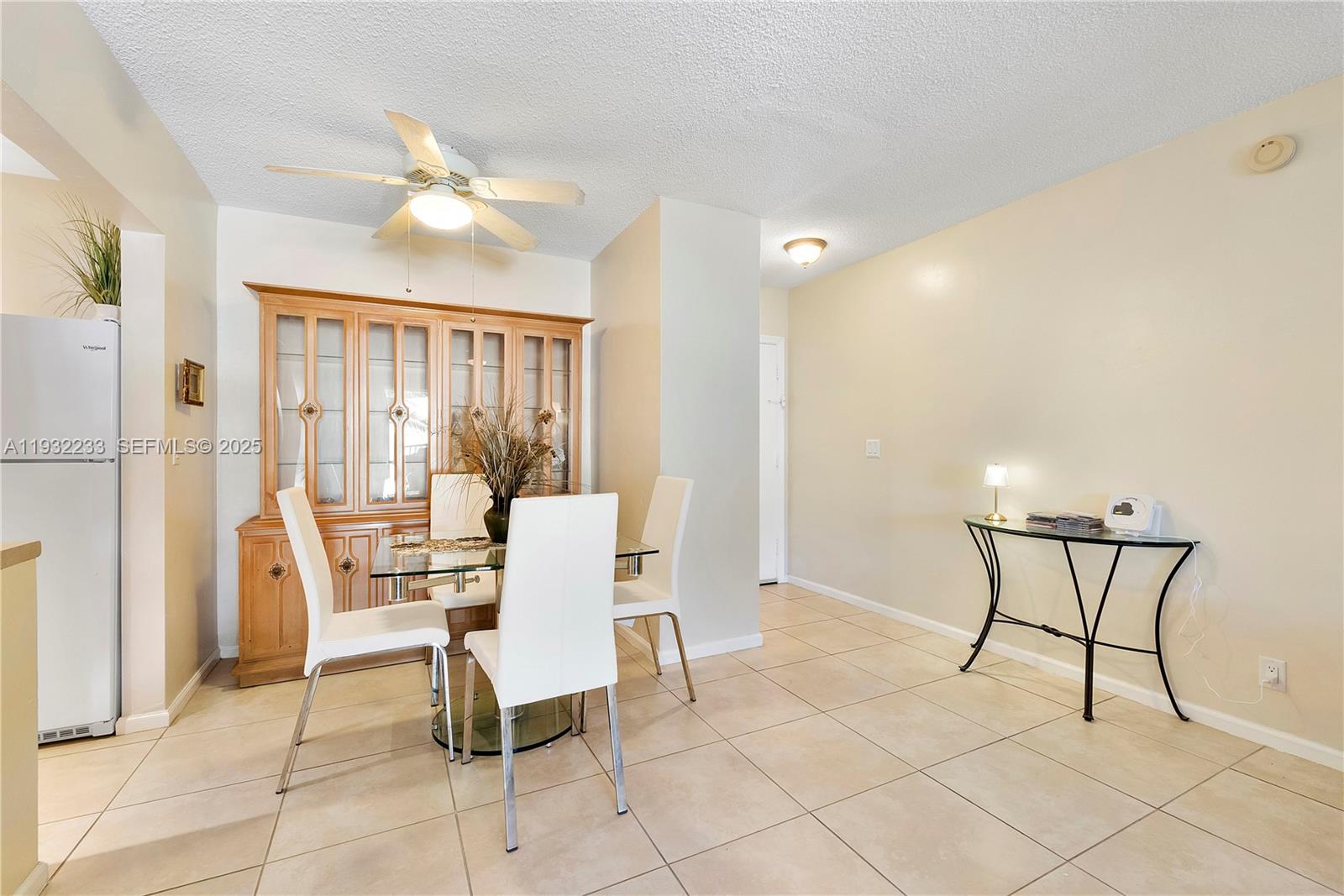 6750 Northeast 21st Road, Unit 124 Fort Lauderdale, FL 33308 - Photo 12 of 50 a dining room with furniture and chandelier