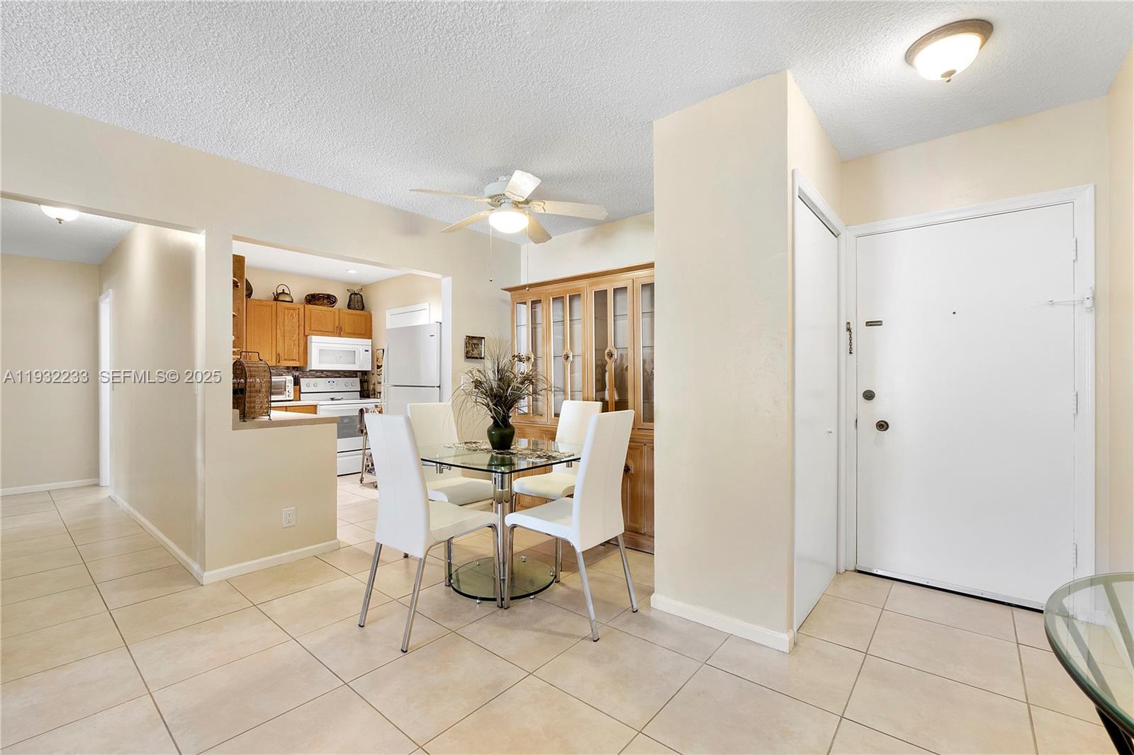 6750 Northeast 21st Road, Unit 124 Fort Lauderdale, FL 33308 - Photo 13 of 50 a view of kitchen with furniture and refrigerator