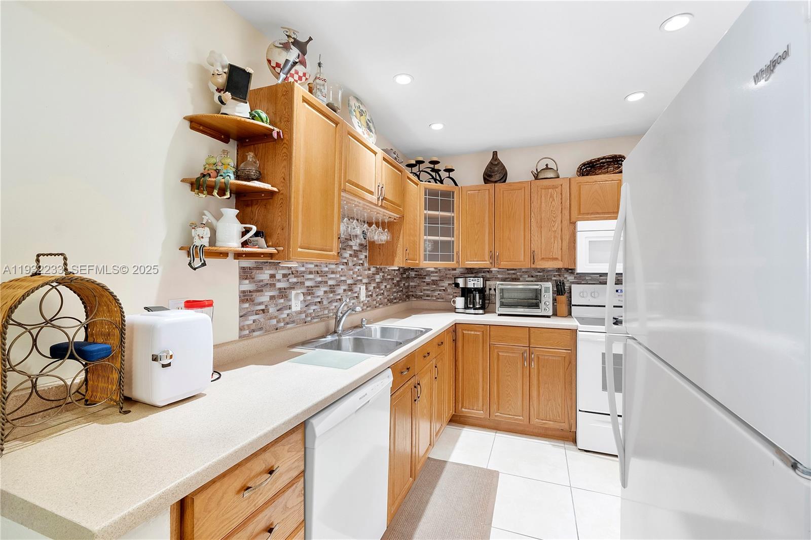 6750 Northeast 21st Road, Unit 124 Fort Lauderdale, FL 33308 - Photo 14 of 50 a kitchen with a sink cabinets and window