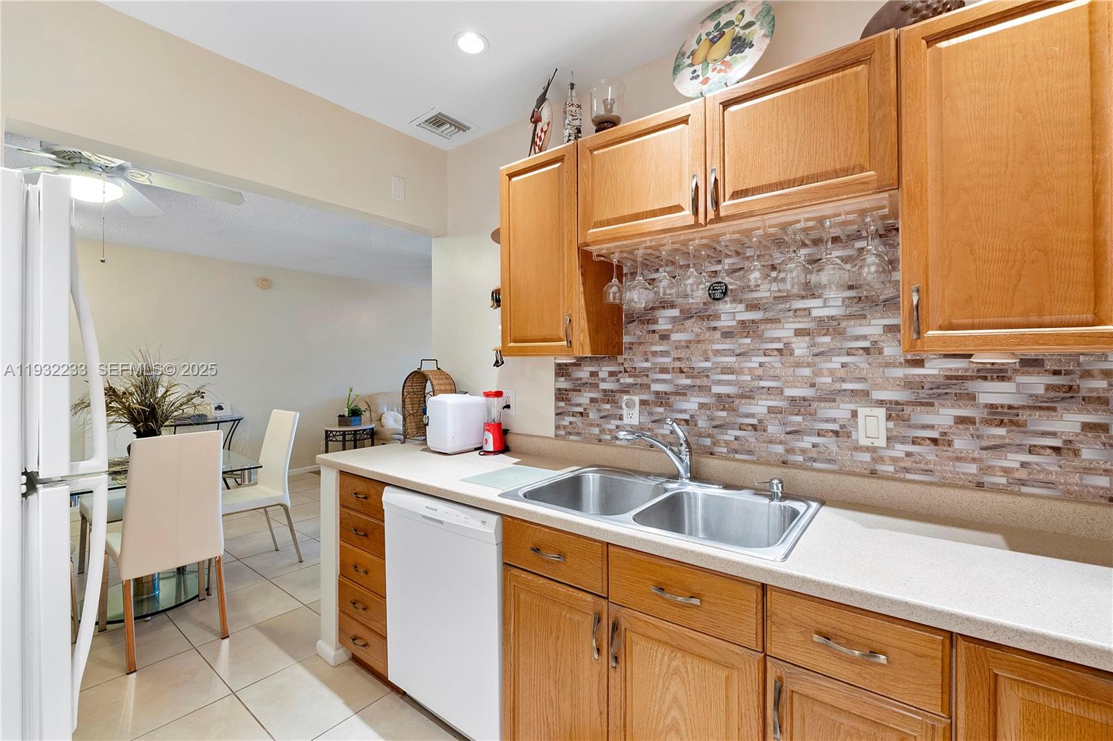 6750 Northeast 21st Road, Unit 124 Fort Lauderdale, FL 33308 - Photo 15 of 50 a kitchen with stainless steel appliances a sink and cabinets