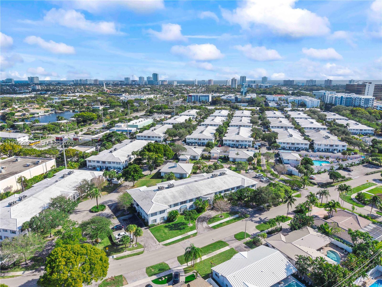 6750 Northeast 21st Road, Unit 124 Fort Lauderdale, FL 33308 - Photo 17 of 50 an aerial view of residential houses with city view