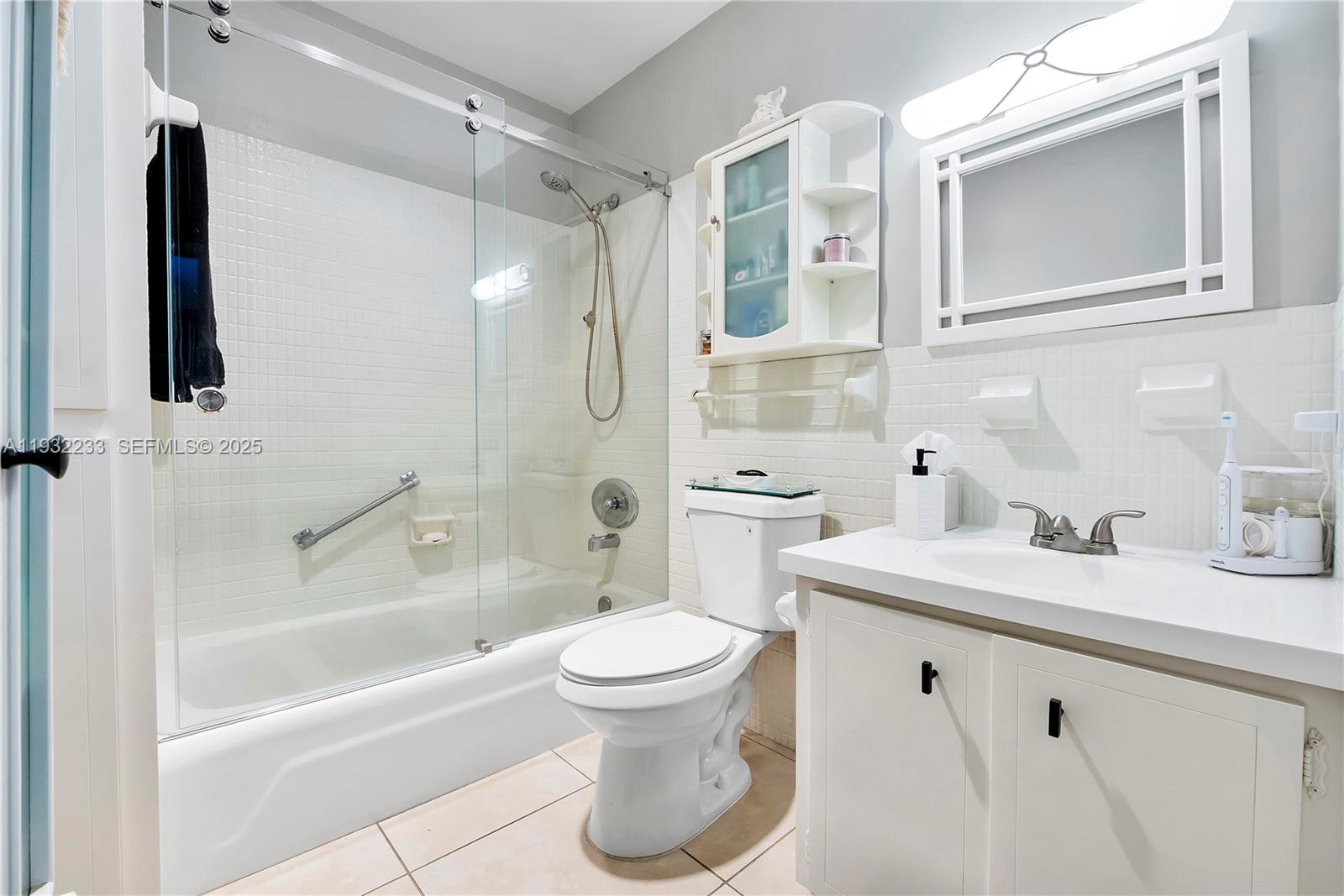 6750 Northeast 21st Road, Unit 124 Fort Lauderdale, FL 33308 - Photo 24 of 50 a bathroom with a sink a toilet and shower