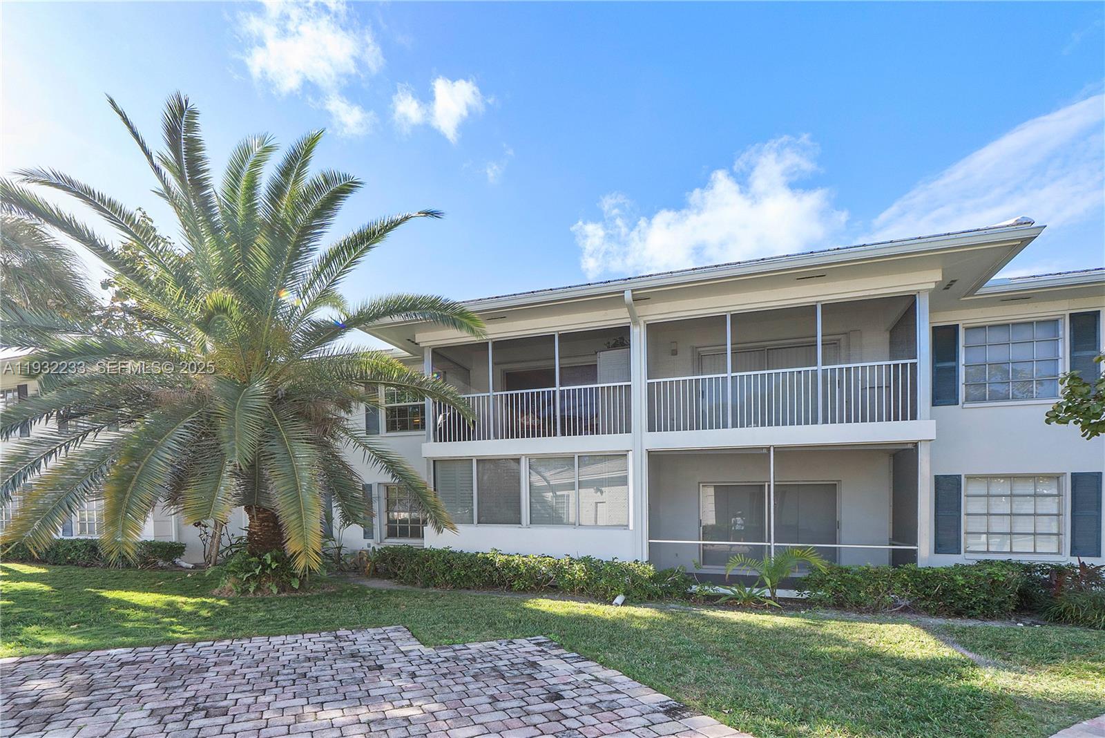 6750 Northeast 21st Road, Unit 124 Fort Lauderdale, FL 33308 - Photo 33 of 50 a view of a building with a yard