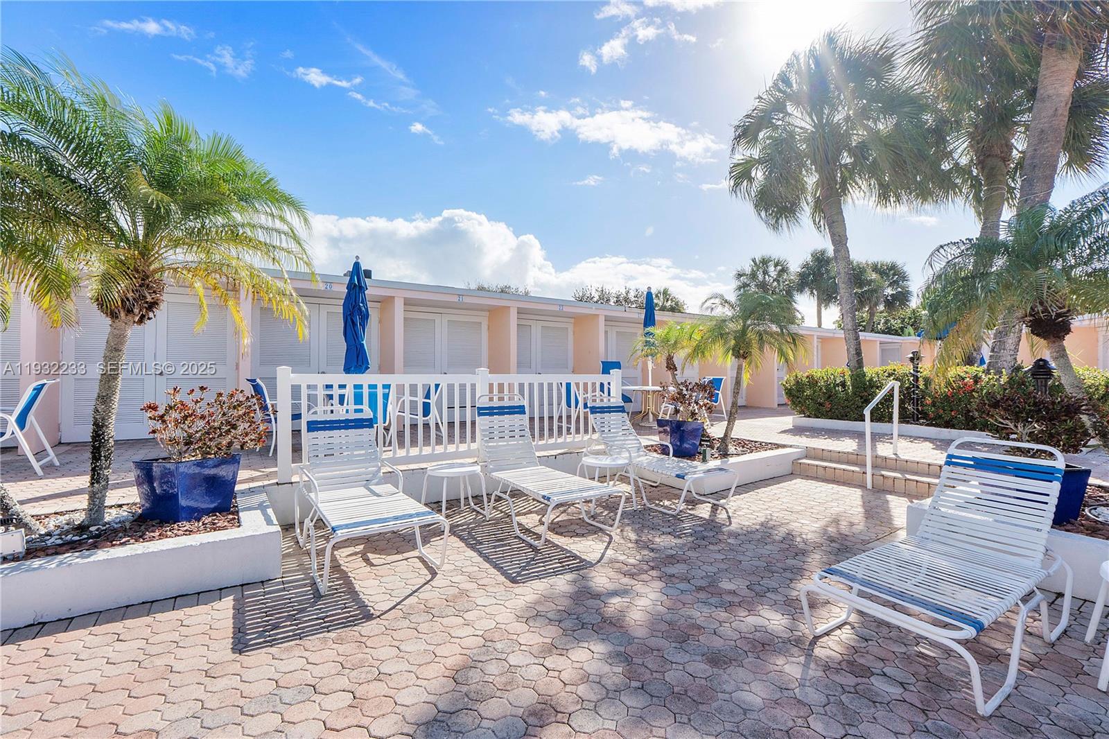 6750 Northeast 21st Road, Unit 124 Fort Lauderdale, FL 33308 - Photo 36 of 50 a view of a backyard with a patio and fire pit
