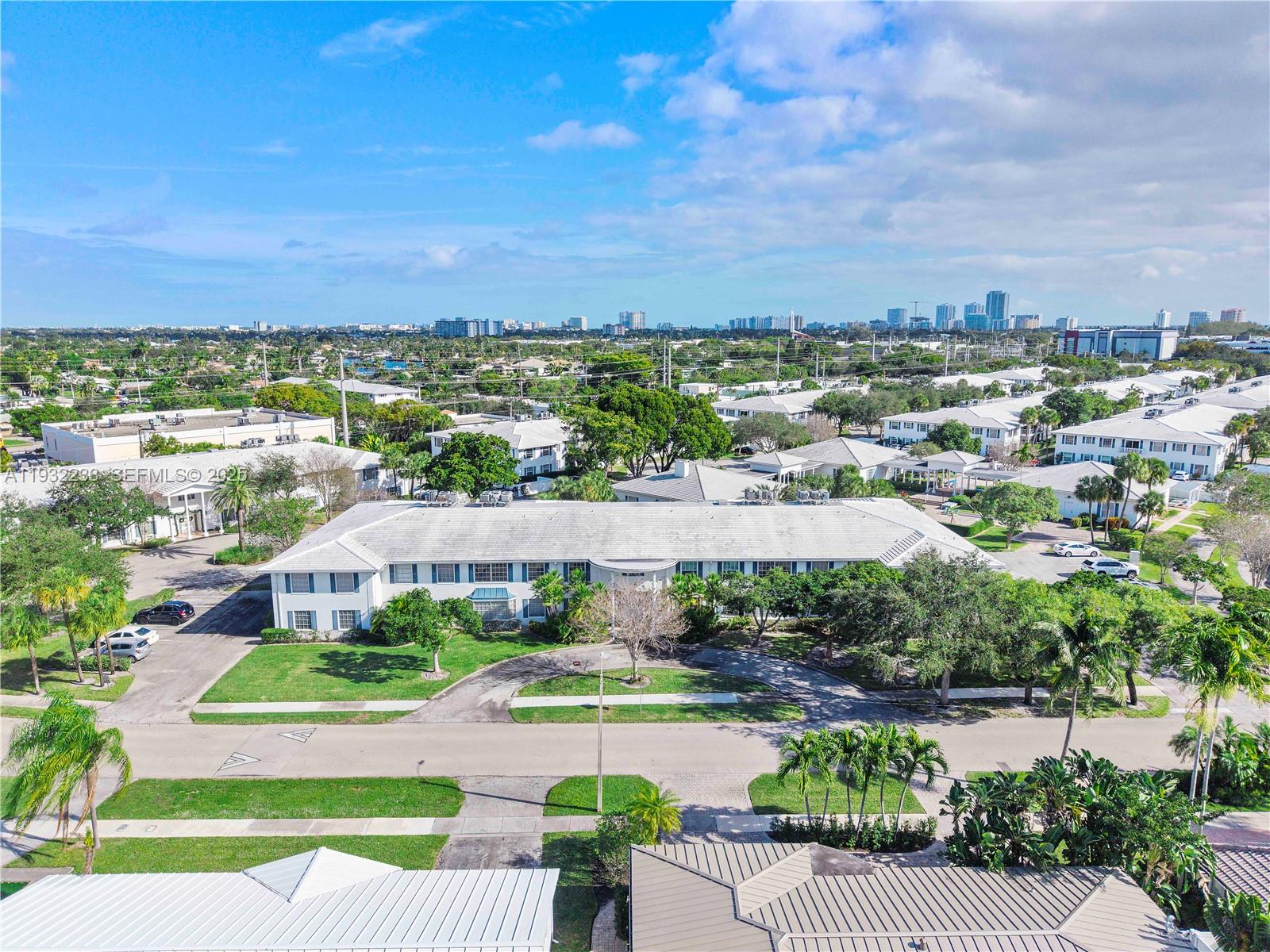 6750 Northeast 21st Road, Unit 124 Fort Lauderdale, FL 33308 - Photo 44 of 50 a view of a city with lawn chairs