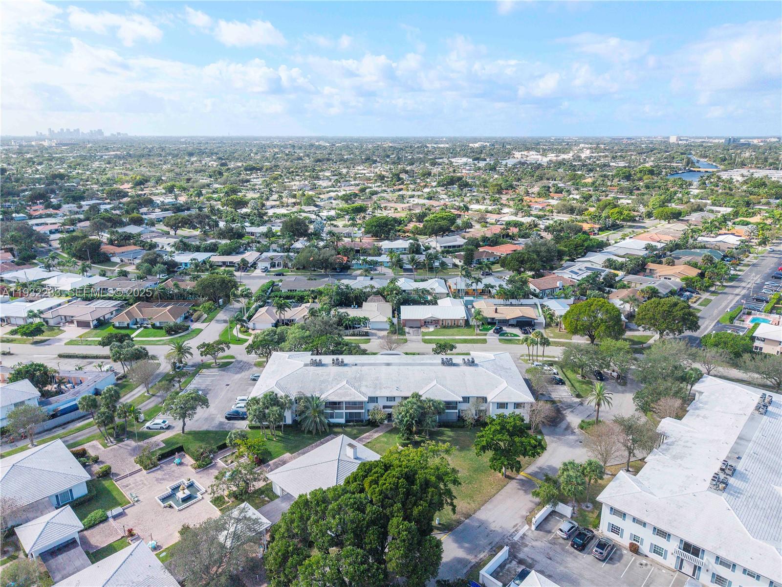 6750 Northeast 21st Road, Unit 124 Fort Lauderdale, FL 33308 - Photo 45 of 50 an aerial view of residential houses with outdoor space