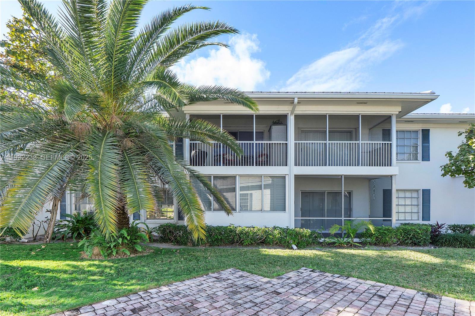 6750 Northeast 21st Road, Unit 124 Fort Lauderdale, FL 33308 - Photo 6 of 50 a view of a brick building next to a yard