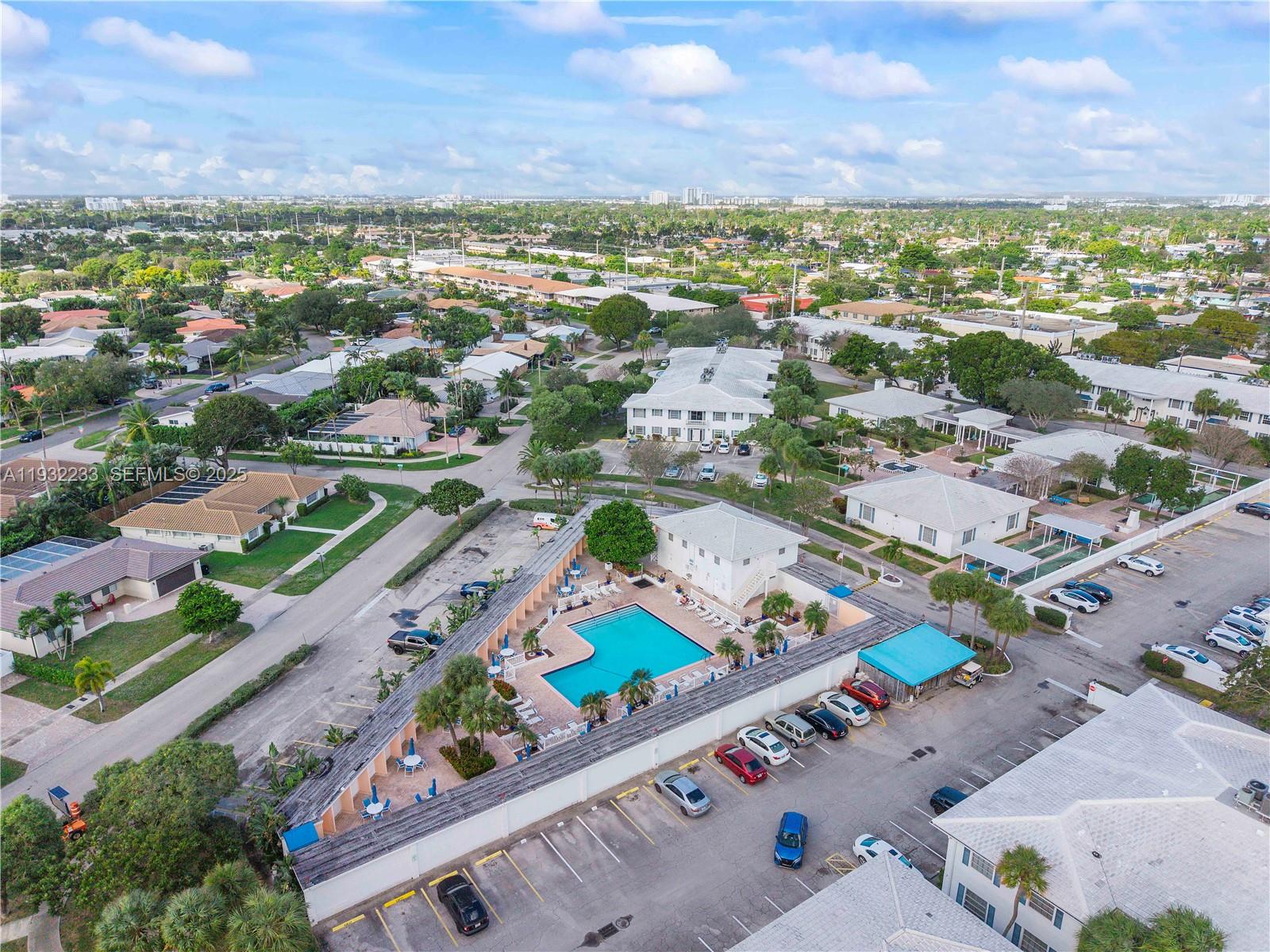 6750 Northeast 21st Road, Unit 124 Fort Lauderdale, FL 33308 - Photo 7 of 50 an aerial view of residential houses with outdoor space