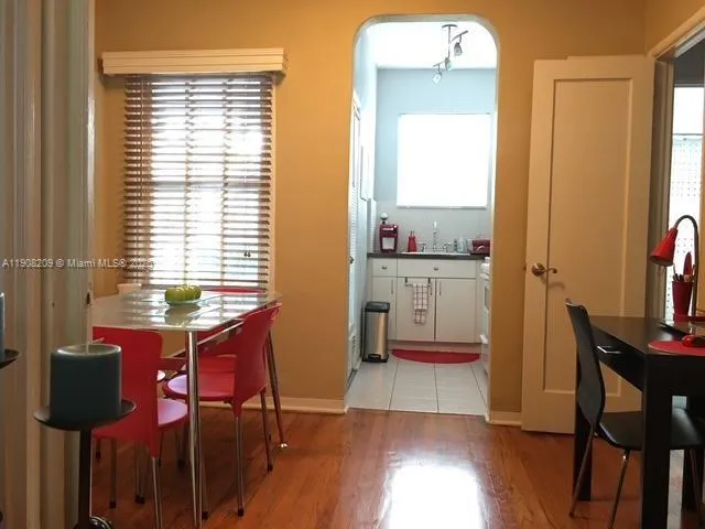 a view of a dining room with furniture and window