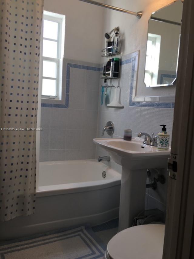 750 Euclid Avenue, Unit 8 Miami Beach, FL 33139 - Photo 7 of 8 a bathroom with a sink toilet and shower