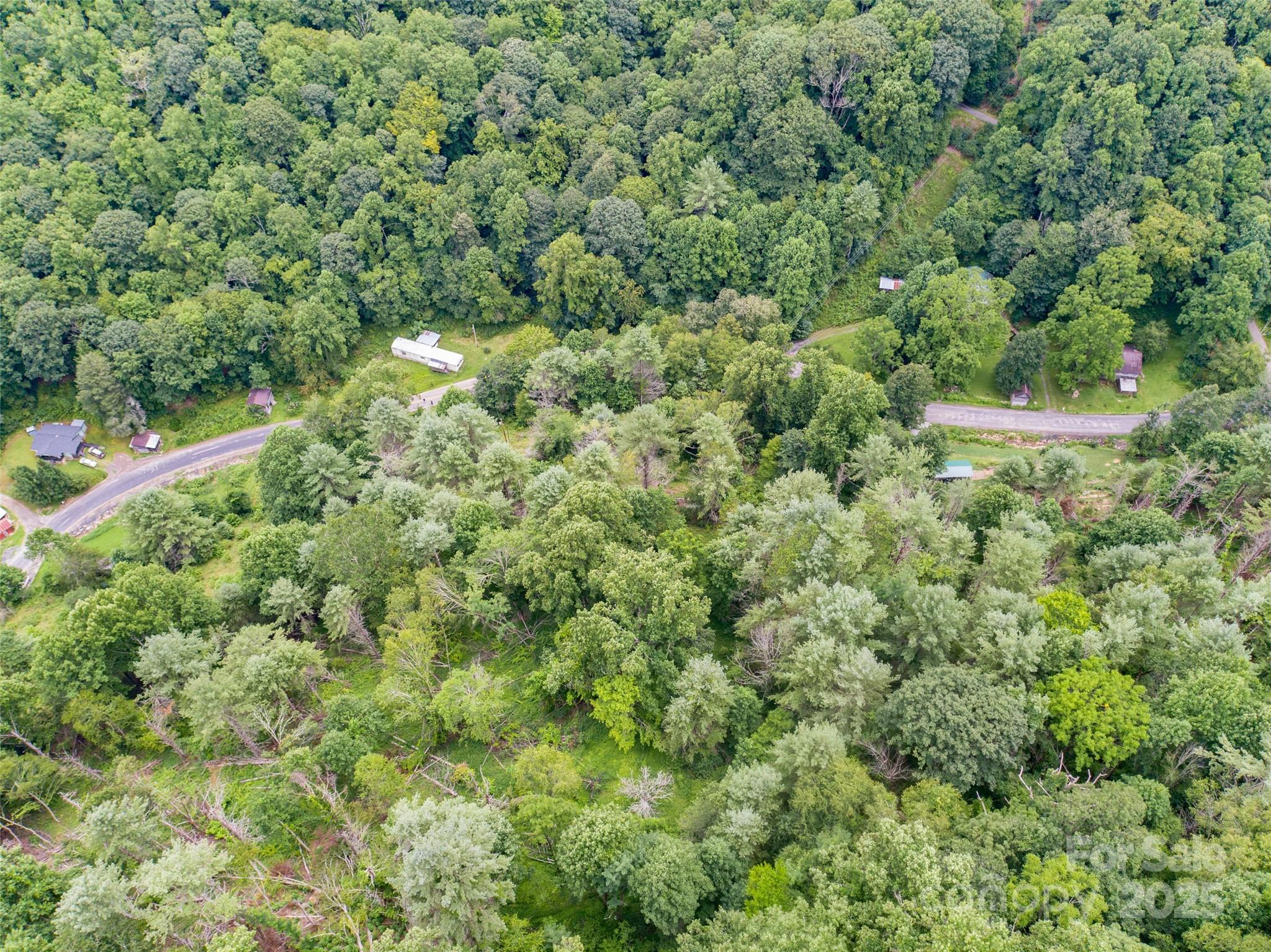 0 Bee Log Road Burnsville, NC 28714 - Photo 5 of 9 an aerial view of residential house with outdoor space and trees all around