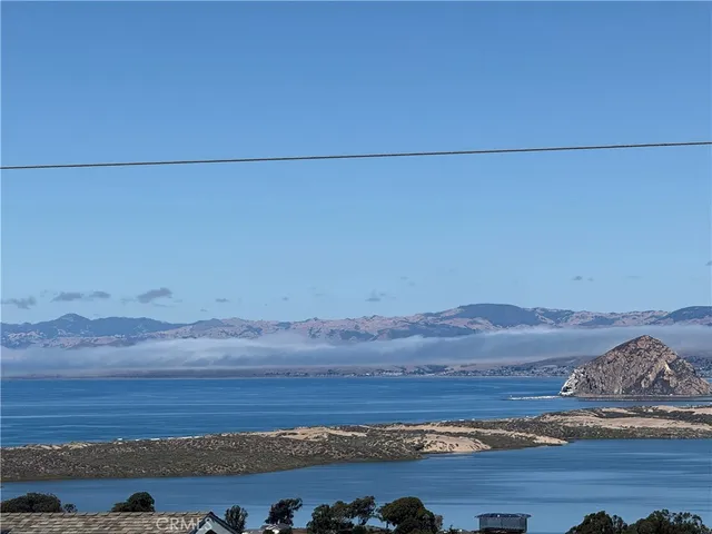 a view of ocean and mountain