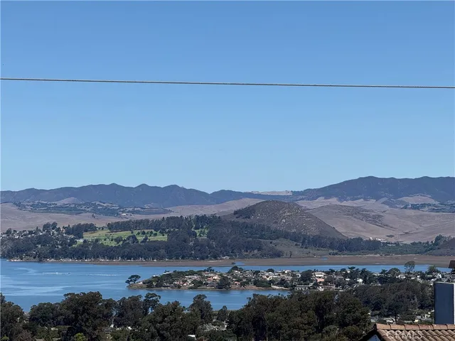 an aerial view of residential house and mountain