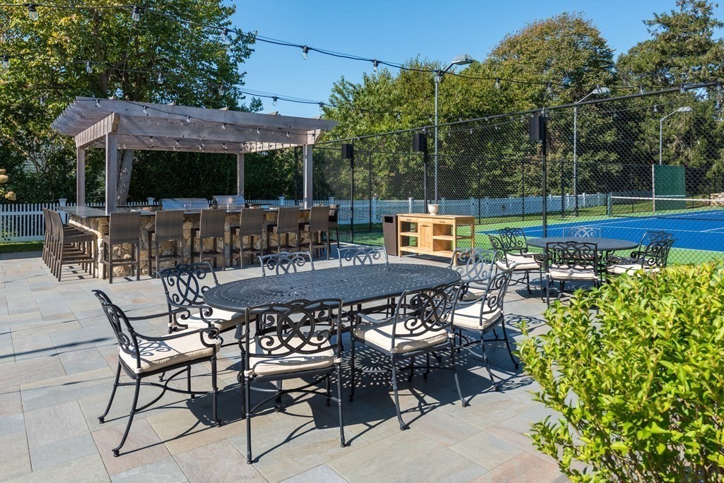 652 Route 28 Harwich, MA 02646 - Photo 13 of 24 a patio with table and chairs