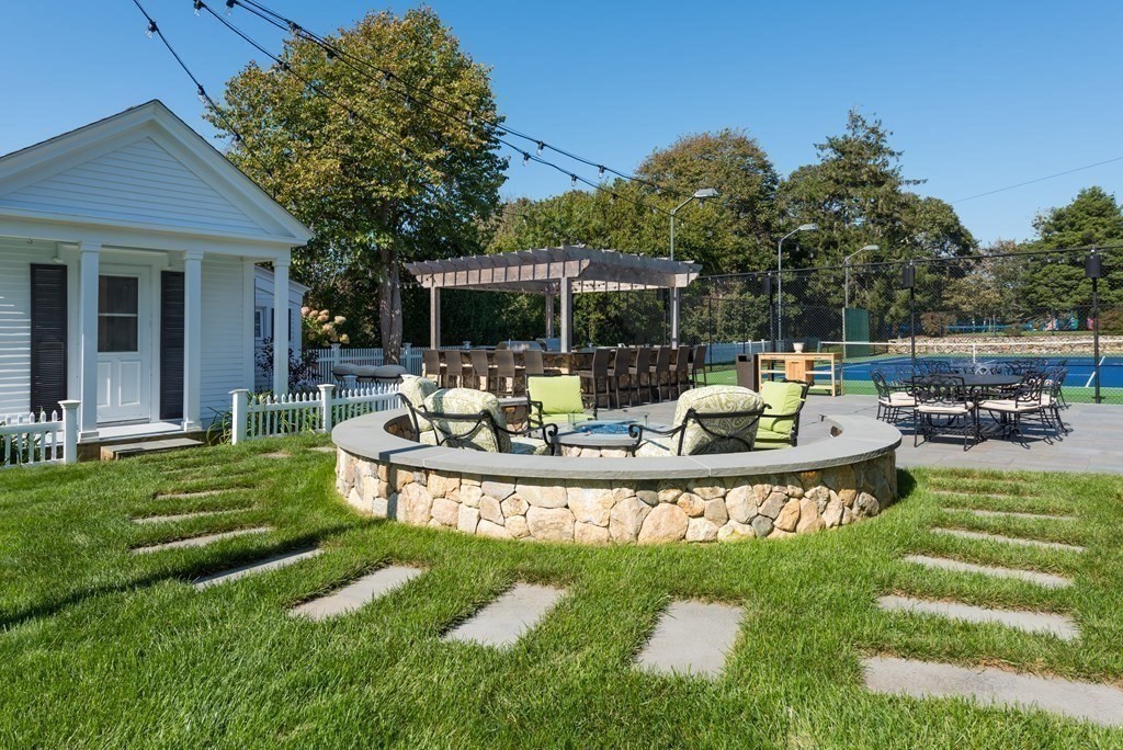 652 Route 28 Harwich, MA 02646 - Photo 8 of 24 a view of a house with backyard patio and swimming pool