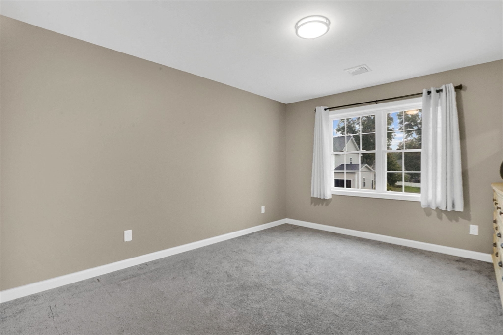 28 Juliet Street Springfield, MA 01118 - Photo 17 of 42 an empty room with windows