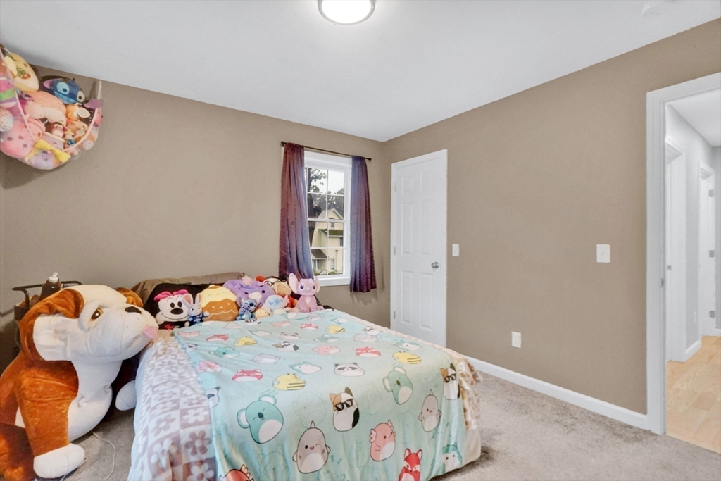 28 Juliet Street Springfield, MA 01118 - Photo 23 of 42 a bedroom with a bed and dresser