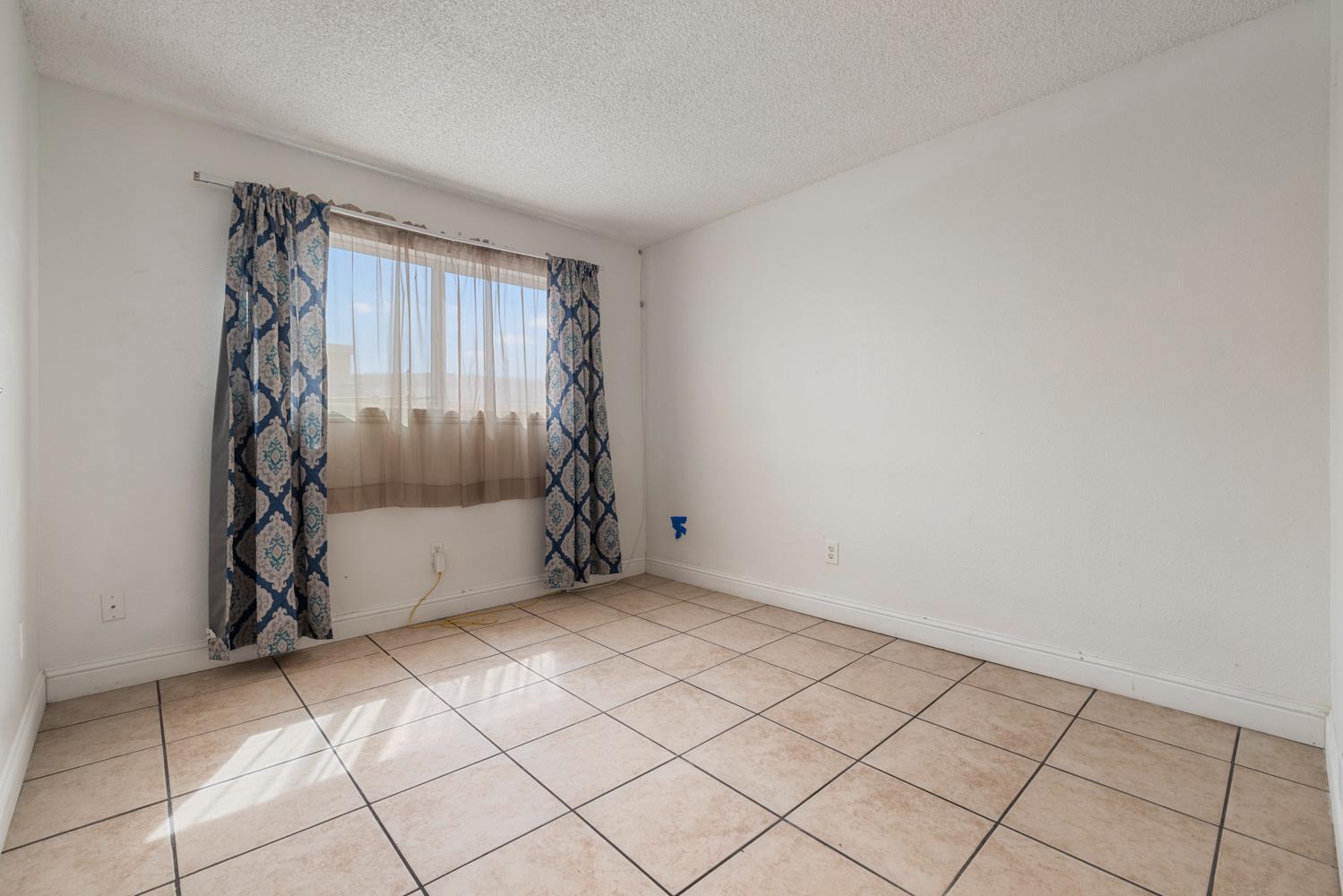 2644 San Ignacio Avenue Modesto, CA 95354 - Photo 18 of 32 a view of an empty room with a window