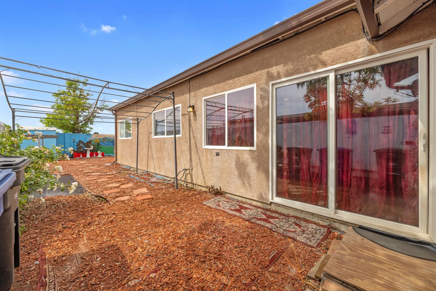 2644 San Ignacio Avenue Modesto, CA 95354 - Photo 23 of 32 a view of a house with a backyard