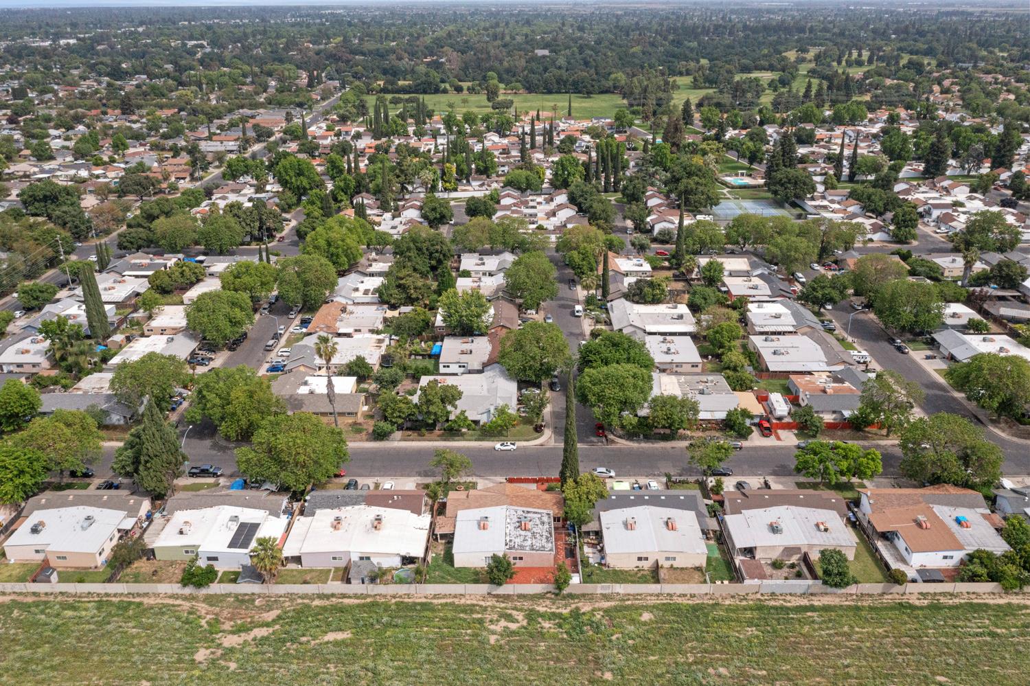 2644 San Ignacio Avenue Modesto, CA 95354 - Photo 29 of 32 an aerial view of house with yard swimming pool and lake view