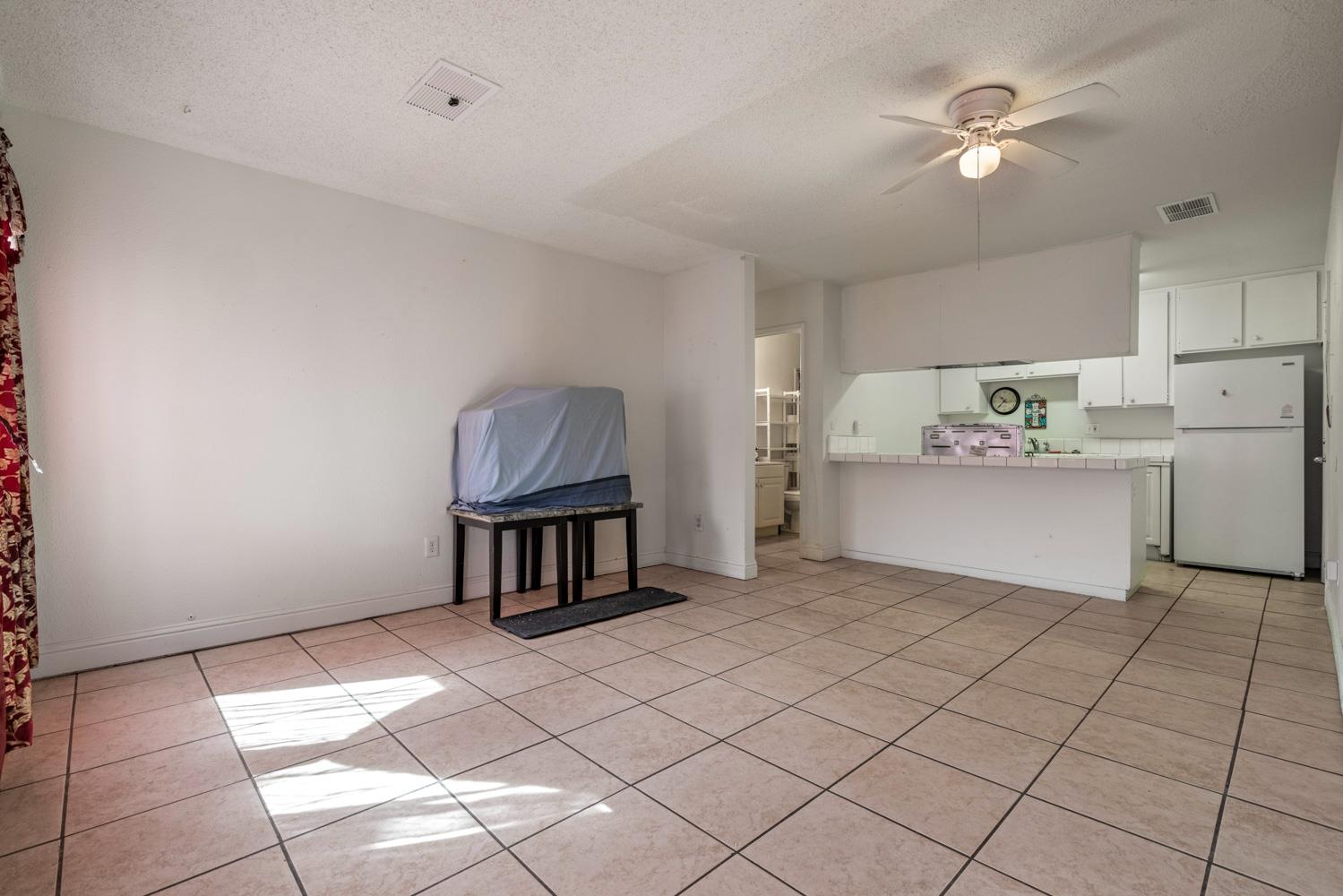 2644 San Ignacio Avenue Modesto, CA 95354 - Photo 7 of 32 a kitchen with stainless steel appliances cabinets and window