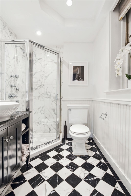 61 Revere Street, Unit 3 Boston, MA 02114 - Photo 12 of 15 a bathroom with a sink a toilet and a shower