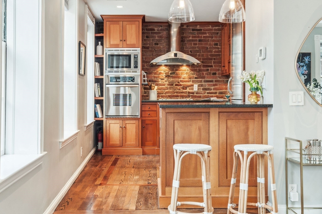 61 Revere Street, Unit 3 Boston, MA 02114 - Photo 5 of 15 a view of a kitchen with a sink and cabinets