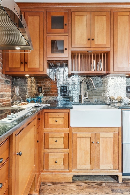 61 Revere Street, Unit 3 Boston, MA 02114 - Photo 6 of 15 a kitchen with stainless steel appliances granite countertop a refrigerator and cabinets