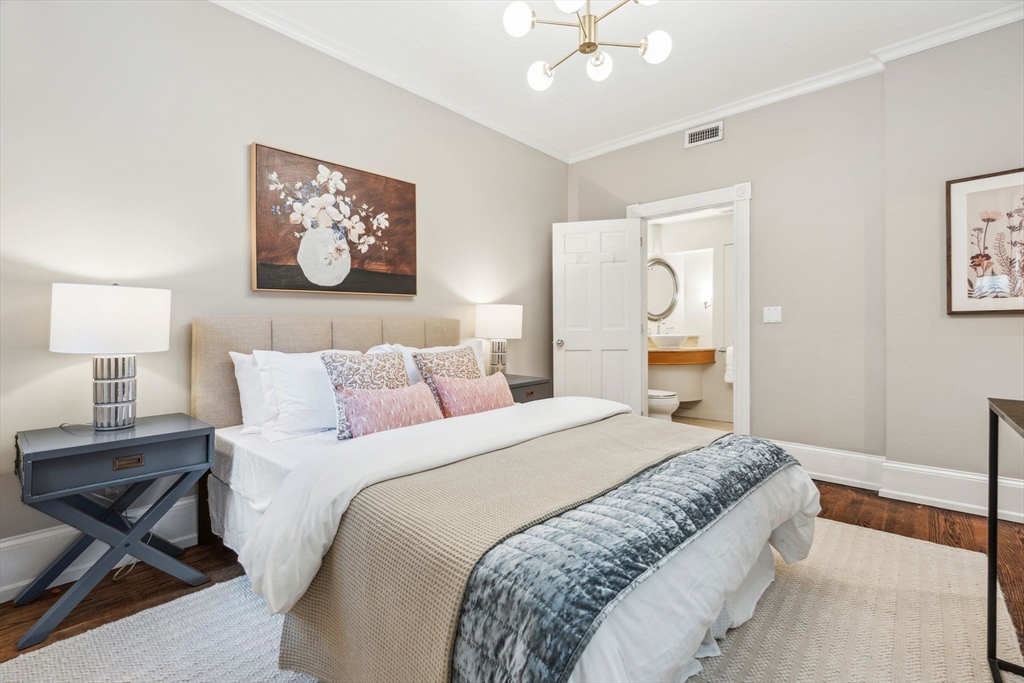 61 Revere Street, Unit 3 Boston, MA 02114 - Photo 8 of 15 a bedroom with bed and painting on the wall